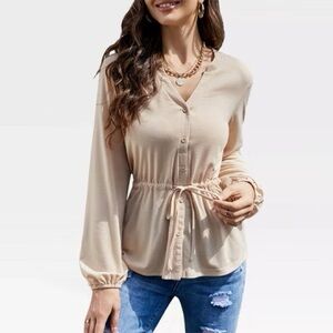 Cream colored tie front button down peplum top